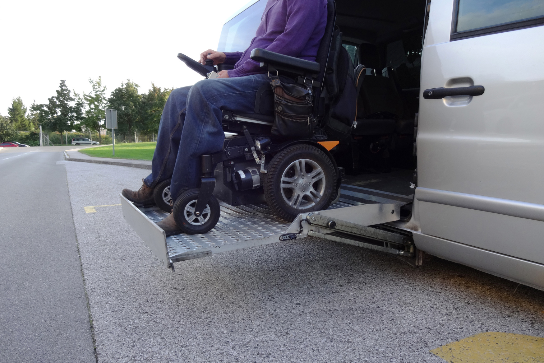 Disabled Man on Wheelchair using vehicle